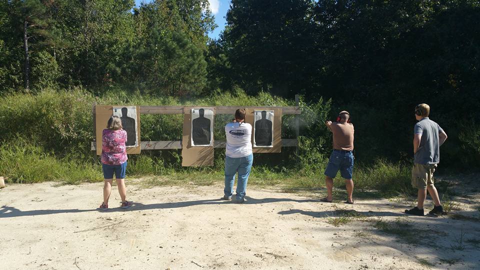 Students practicing safely at the outdoor range